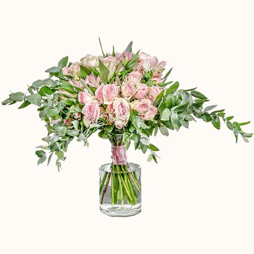 Pink 'Sorbet Roses' flowers in a small vase